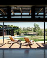 Twenty-foot-wide doors from Solar Innovations offer easy access to the deck. “Solar Innovations was the only manufacturer at that time that had a pocket multi-slider with a good ADA threshold,” says architect Erick Mikiten. “They almost look like steel, but are thermally broken aluminum.”