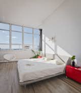 Last but not least, the western-facing master bedroom captures stunning sunsets from its wall-to-wall windows.