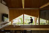 Covered, veranda-like spaces on both sides provide shady areas to sit and relax.