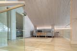The second level showcases the ceiling’s rimakatto finish. The battens soften the home’s appearance while improving acoustics.