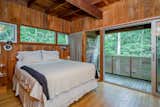 Upstairs, the principal bedroom connects to a private patio that overlooks the backyard.