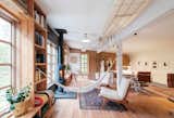 In turning the second level of the garage behind their duplex into a multifunctional workspace without breaking the bank, Kyle Huberty relied on friends, family, and the community at large.