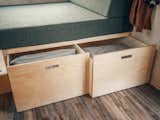 Two sizable storage drawers pull out from beneath the built-in daybed in the living area.