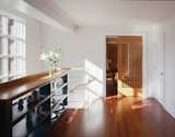 Custom American cherry pocket doors lead to the dining room.  By RobitailleCurtis