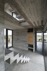 Exposed concrete is used for the rail-less stairs.