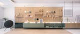 A modular furniture wall, which the RIGI team refers to as a "life board," was used as a flexible system that accommodates various storage and shelving configurations.
