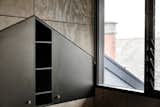 In an upstairs bedroom, striking triangular cabinetry is built into the Victorian house's attic.