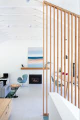 Art by Zoe Pawlak sits on the mantle with an Eames Bird from Herman Miller.