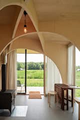 In addition to poplar plywood surfaces, the interior features linoleum floors and wood wool insulation. The wood-burning stove is Prity's Mini model.
