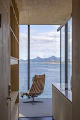 The view from the hallway with the bathroom to the left, the kitchen to the right, and the living area ahead. Directly behind is the additional bedroom with an elevated bed that has a private entrance and can also function as a storage room.