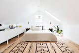 The second bedroom peaks at seven feet, so even adults can stand straight up in the lofted room. "It’s been really fun for our friends that have kids because they can have their own space," says Lauren. It also doubles as a studio and workspace. 
