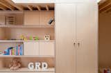It was necessary to step the floor in the loft bedroom up to provide head height for the new hallway on the first floor. This provided the perfect space for the toy shelves and the wardrobe. 