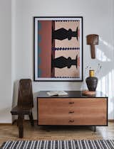 A vignette anchored by an Olga Fradina print in the second bedroom.