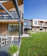 The larch slats above the brick reference a history of agriculture buildings in the area.