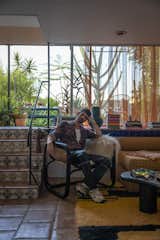 <span style="font-family: Theinhardt, -apple-system, BlinkMacSystemFont, &quot;Segoe UI&quot;, Roboto, Oxygen-Sans, Ubuntu, Cantarell, &quot;Helvetica Neue&quot;, sans-serif;">Thomas seated in a vintage chair by the ceramic tile stairs, which are decorated with a kooky trio of ceramics: a cast of rubber gloves, a sandal, and another oddity on the top step which he liked for its slightly perverse glazing. "I like a little bit of stupidity in pretty much everything I do, and I mean that in the best possible way,
