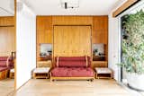 The Mirror in This Tiny Brazil Apartment Hides an Entire Work-From-Home Setup